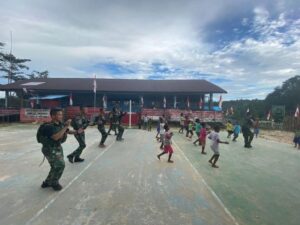 Bahkti TNI Satgas Yonif 501/BY Bersama