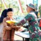 Prajurit Kostrad Gandeng Bulog Gelar Bazar Beras Murah di Desa Harjokuncaran, Malang