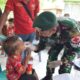 Tingkatkan Kualitas Kesehatan, Tim Kesehatan Satgas Pamtas Yonarhanud 2 Kostrad Adakan Kegiatan Posyandu di Desa Naekake