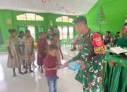 Satgas Pamtas Yonarhanud 2 Kostrad Bagikan Buku Rohani di Wilayah Perbatasan