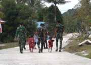 Senyum Anak-Anak Warnai Hasil Pembangunan Jalan Cor 250 Meter TMMD Ke-129 di Kampung Sesor